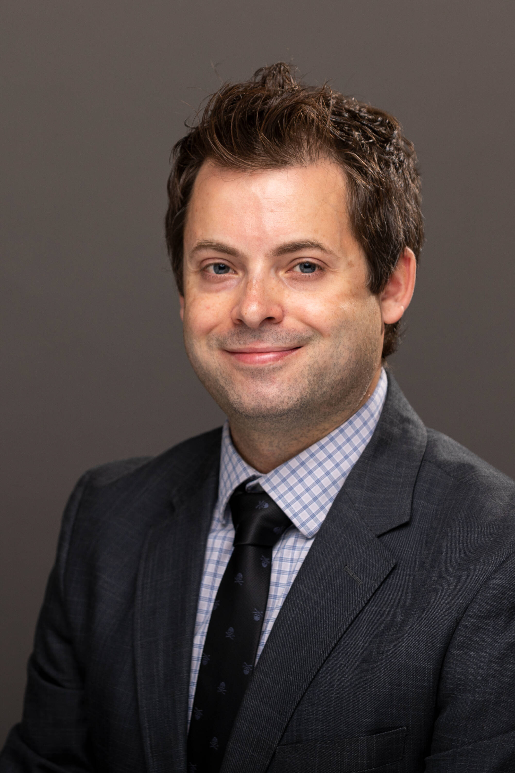 Studio portrait of Erik Fredericks.